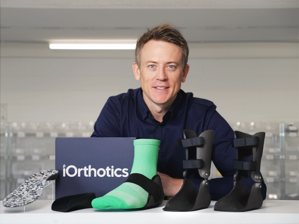 iOrthotics clinician with a range of custom 3D-printed orthotic devices and braces