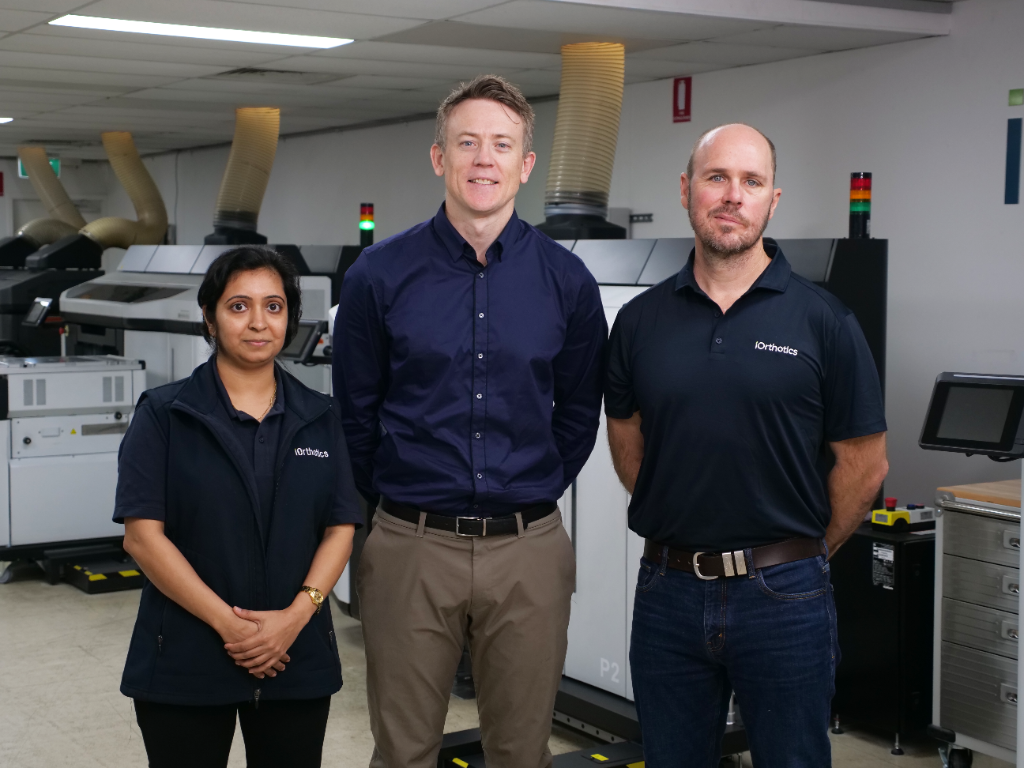 iOrthotics clinical team standing in the print room