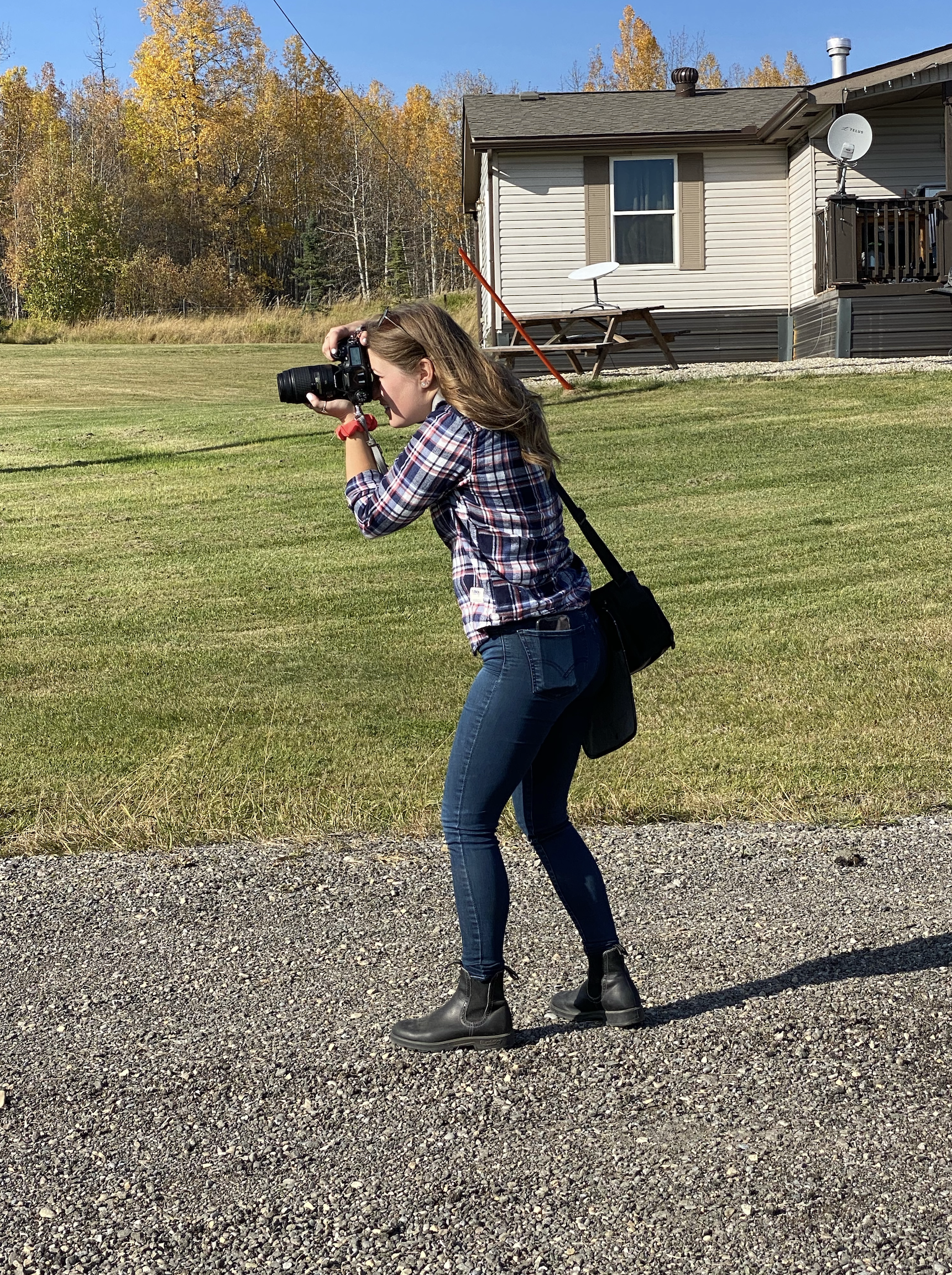 Taylor photographing outdoors with her camera