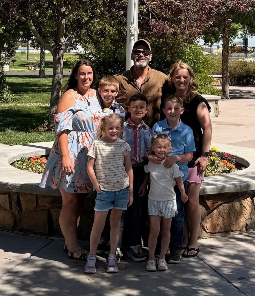 Family photo by the flagpole