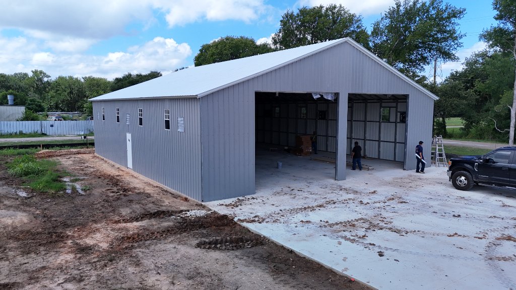 Custom commercial metal building manufactured by Rough Country in Temple, Texas — aerial drone view of completed steel structure