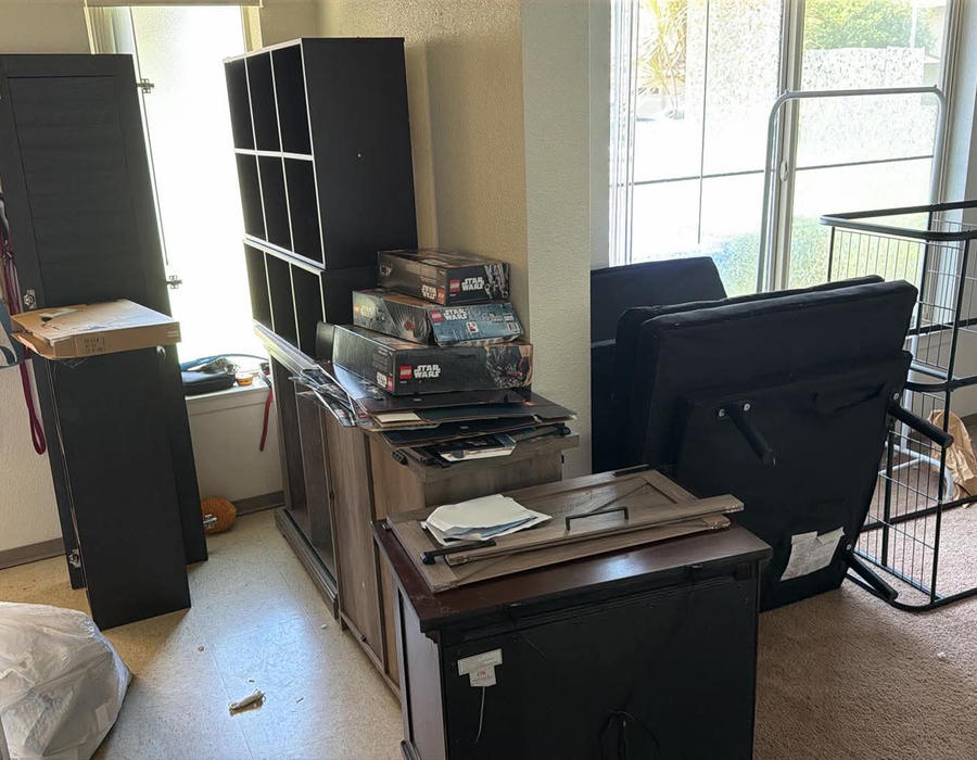 Furniture and clutter inside a Pearl Harbor home before removal