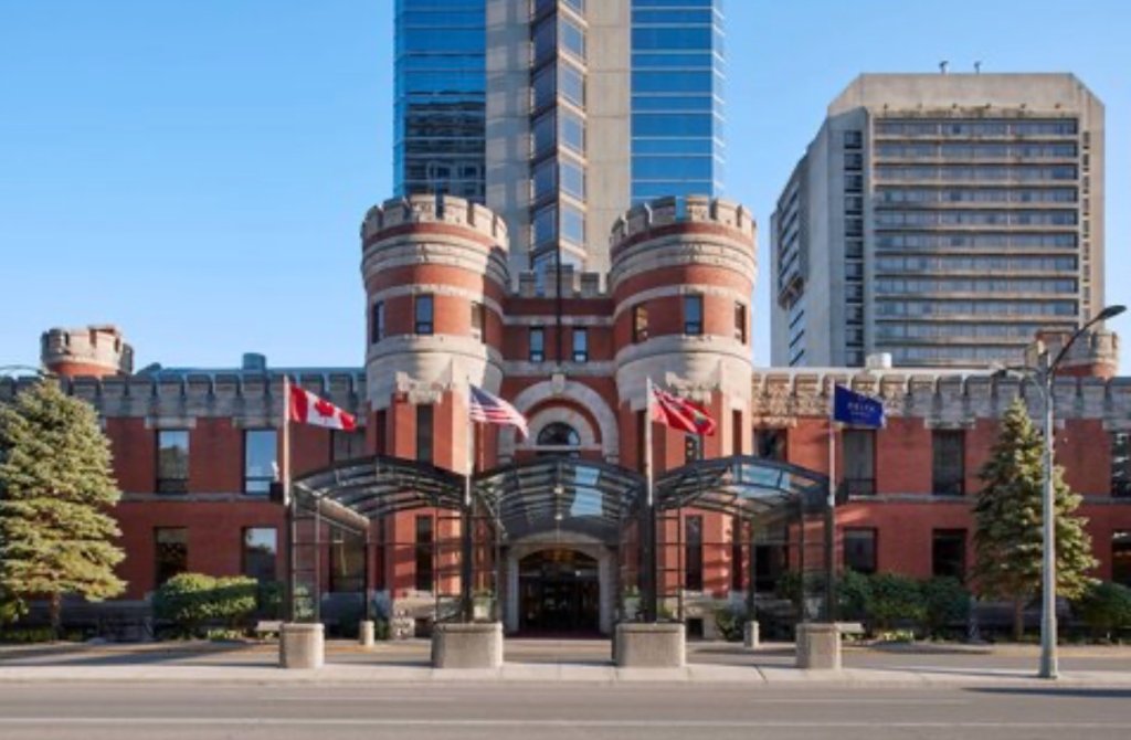 Delta Hotels by Marriott London Armouries exterior with historic red-brick facade and modern glass tower