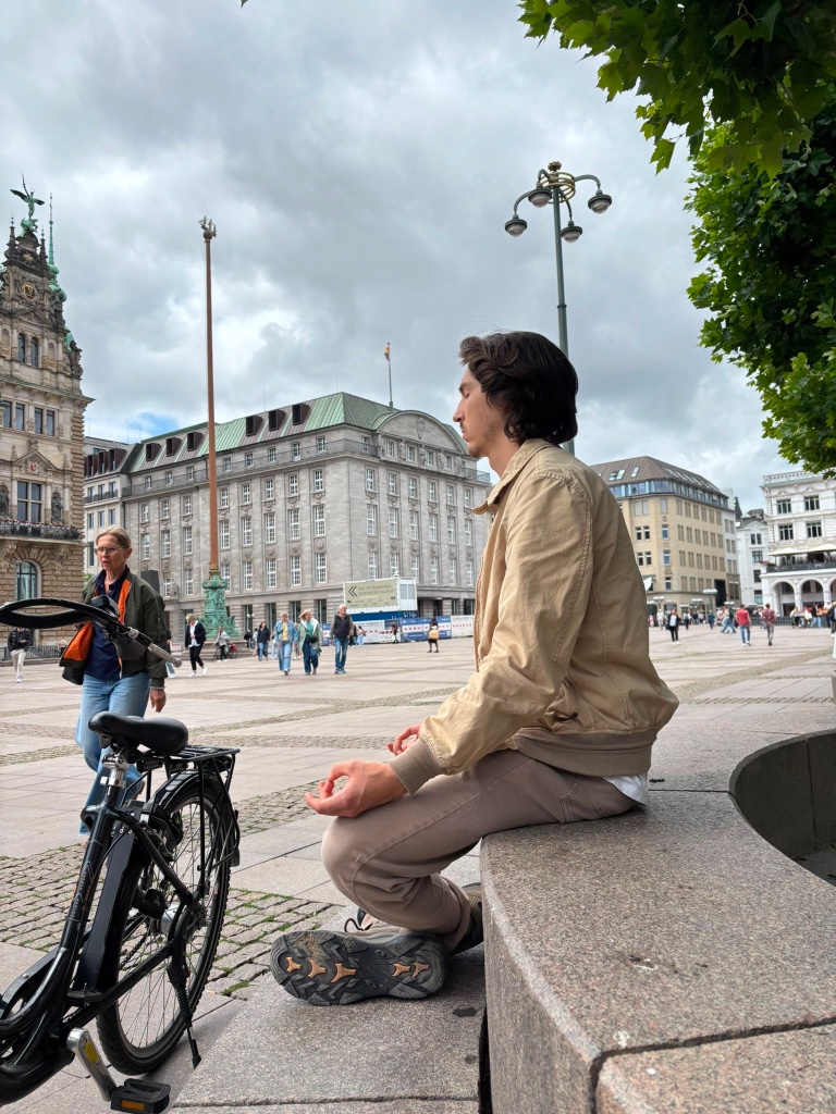 Quintin meditating in a city