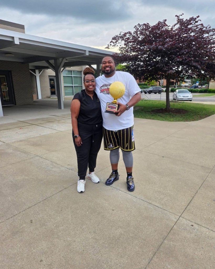 Provider with basketball champion at community IV event – Radiant Health