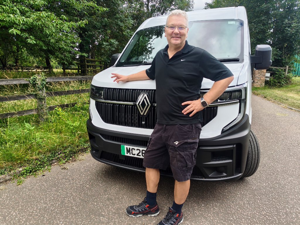 Owen, owner of OBTA Logistics, beside the OBTA delivery van