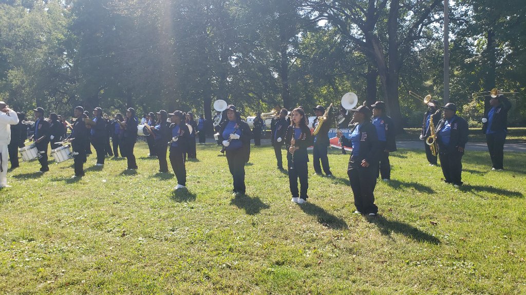 Marching band performing at the EMMAFEST parade