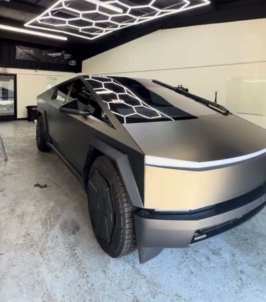 Matte black Tesla Cybertruck with vinyl wrap inside the Royal Window Tint shop