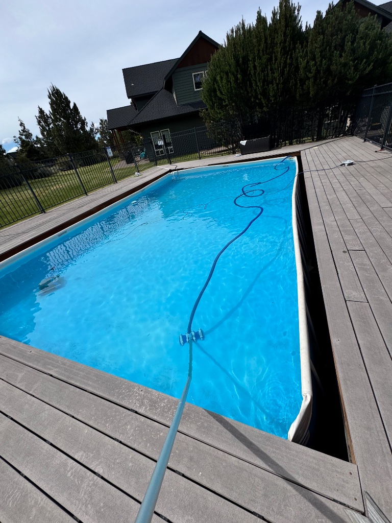 Clean pool on a wooden deck