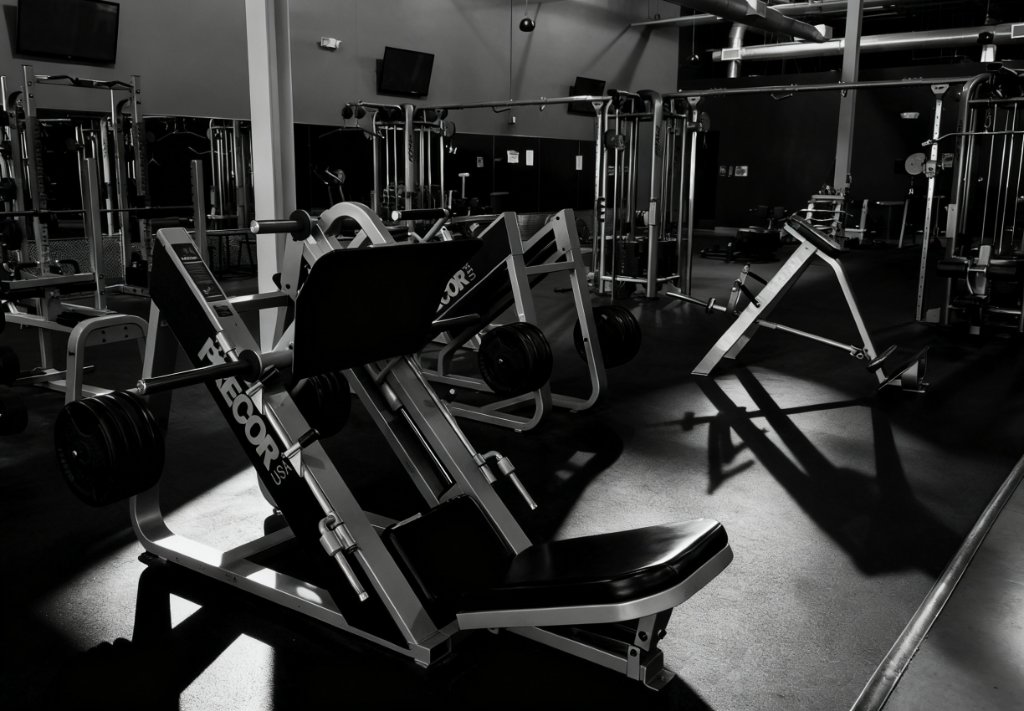 Low-angle shot of a Precor leg press machine on the gym floor
