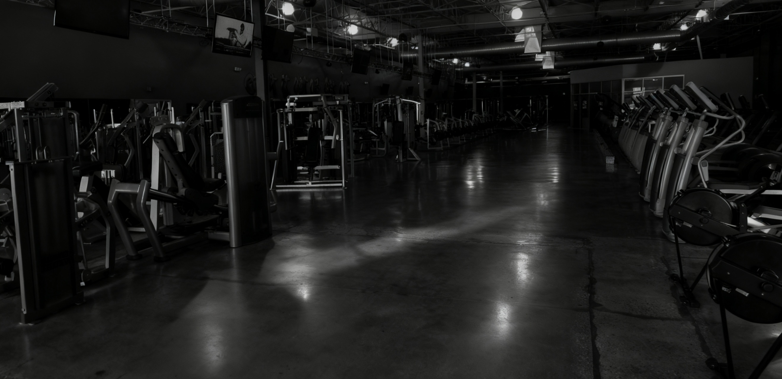 Focused athlete performing a deadlift in dramatic side lighting