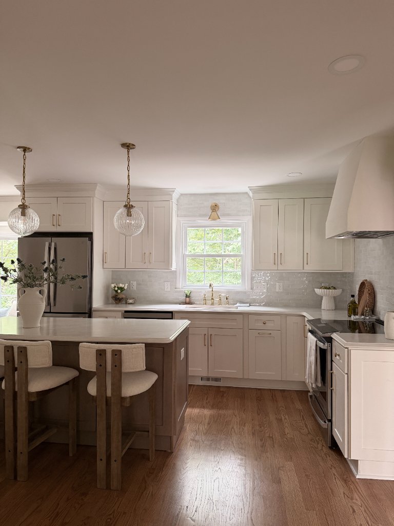Modern kitchen renovation in Raleigh, NC with marble countertops and hardwood floors
