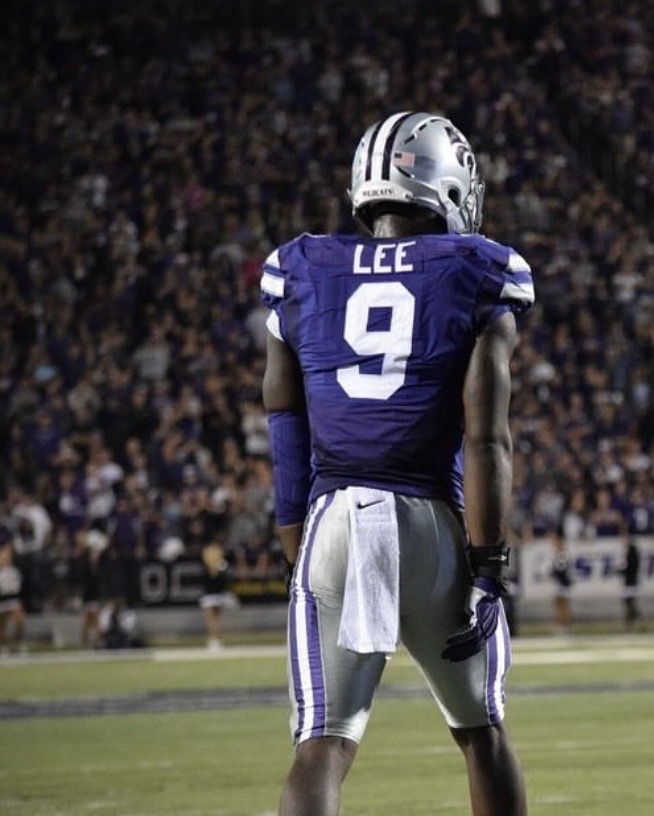 Elijah Lee facing the field at night