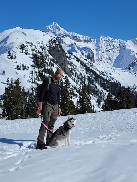 Rosé standing proud on snowy mountain peak