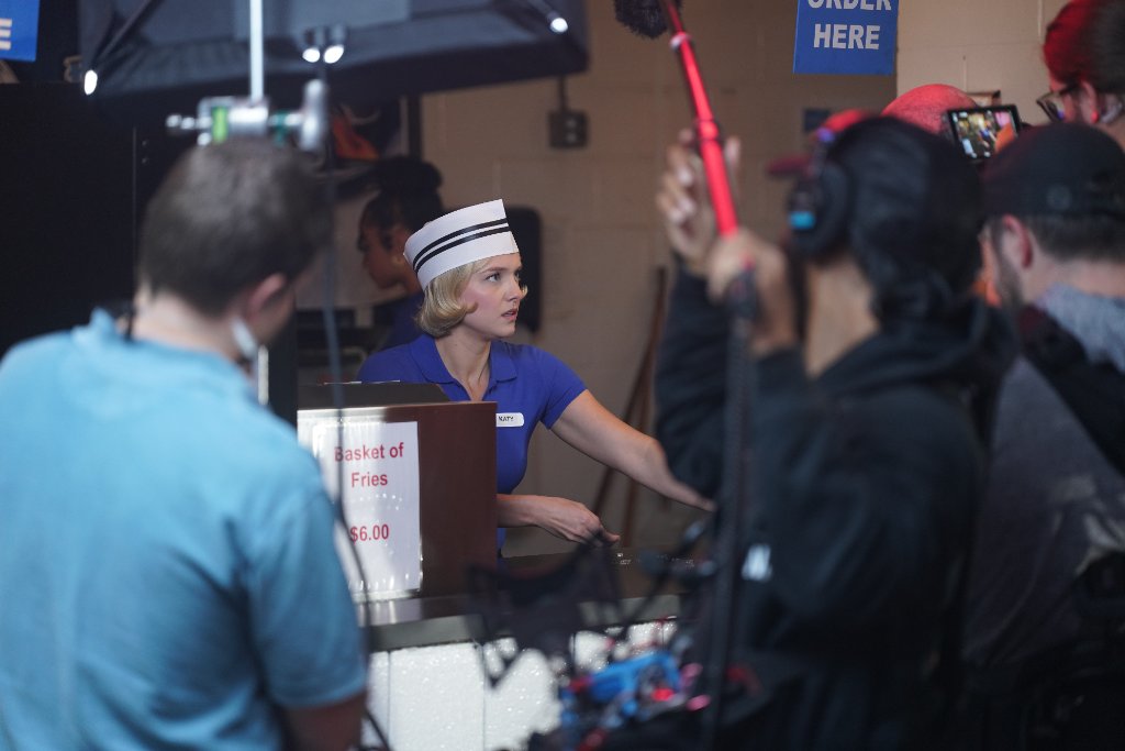 Full production set with crew and actor