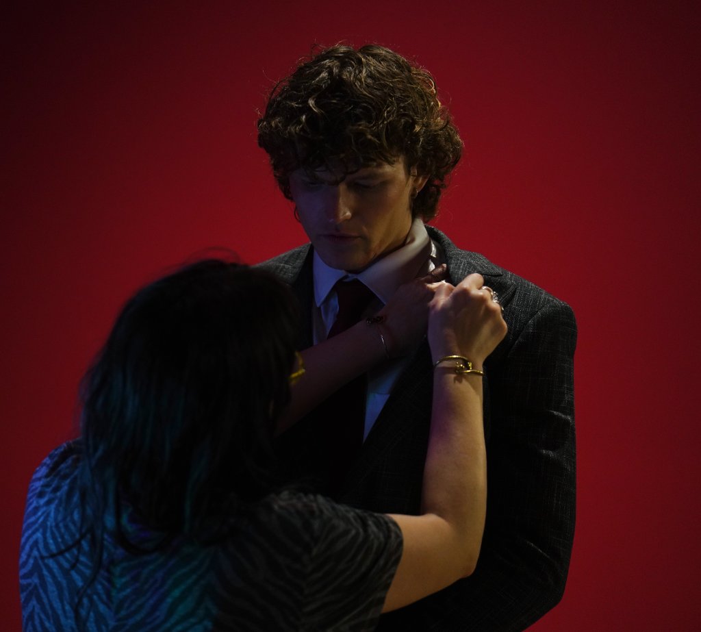 Wardrobe and actor on set