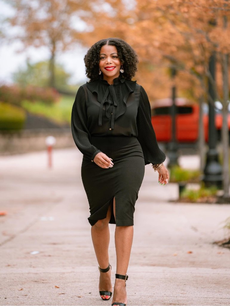 Commissioner Erica Crawley, a determined leader in an urban park setting