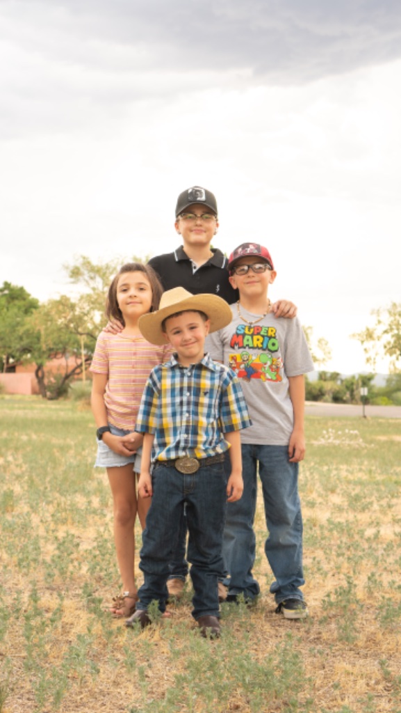 Family portrait in a park — four siblings by Jose A. Palafox