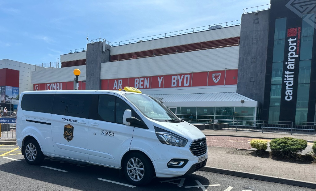 Ow's Travel minibus at Cardiff Airport
