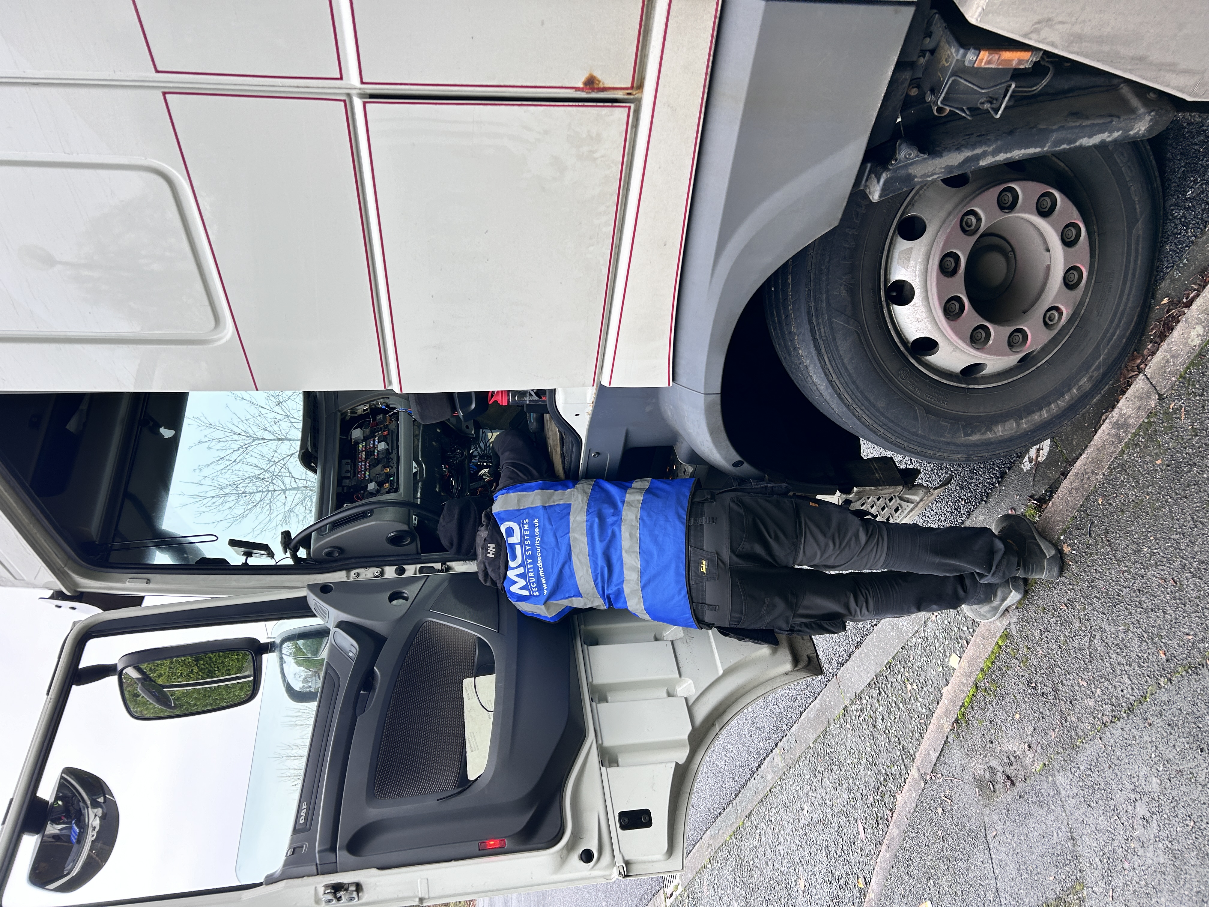 MCD Vehicle Systems engineer fitting DVS PSS equipment on DAF HGV