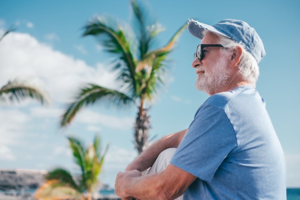Senior traveler enjoying a peaceful moment in the tropics