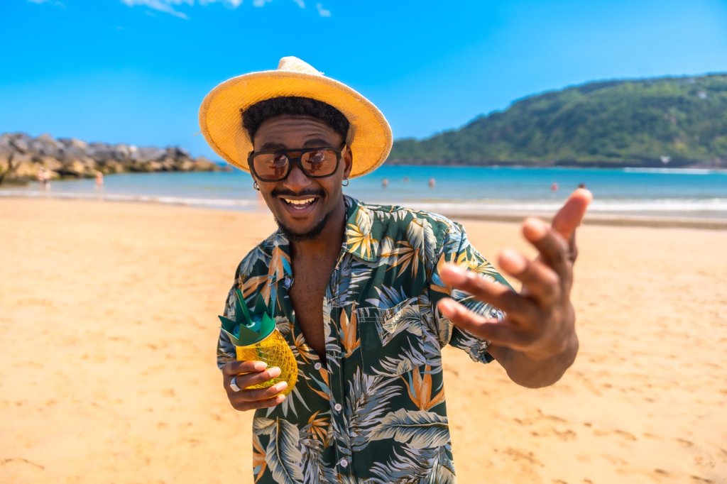 Traveler enjoying a tropical cocktail on a Philippine beach