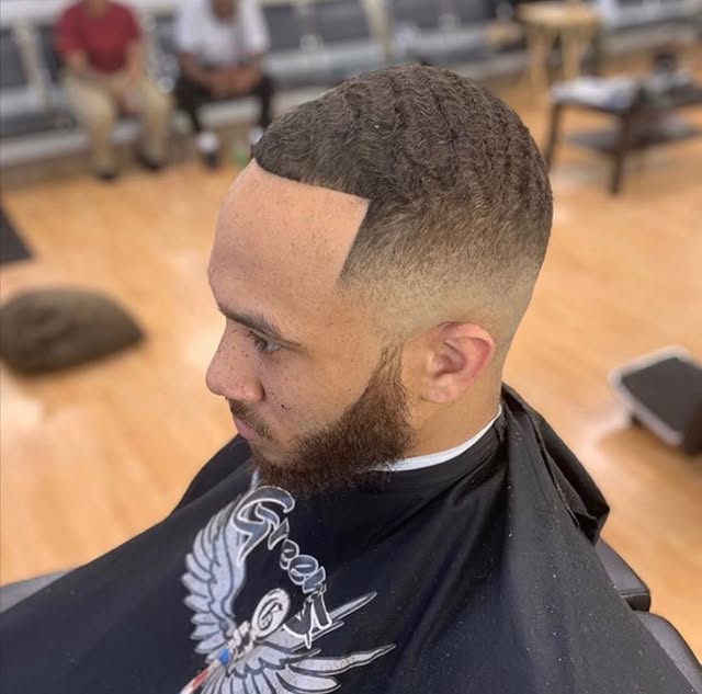High top fade with shape-up at Greene's Barber Service