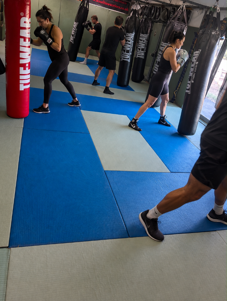 Kickboxing for fitness room — warriors training on the bags