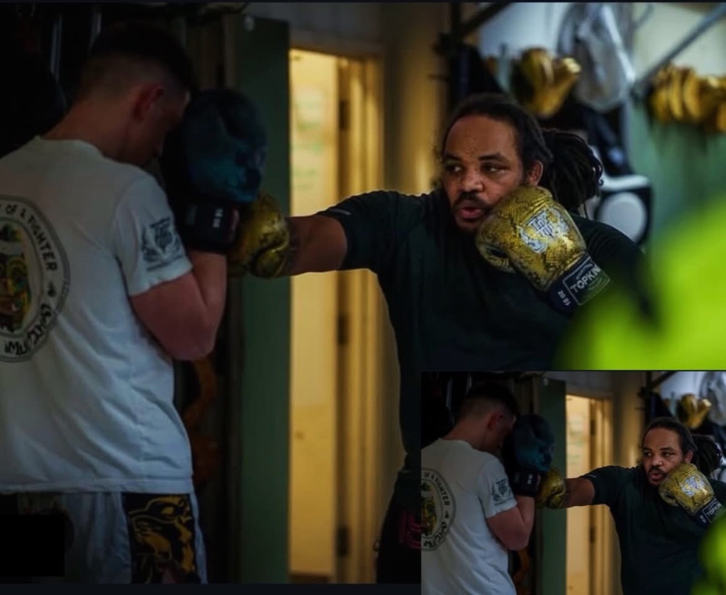 Warrior in boxing stance at dawn in Hampshire field