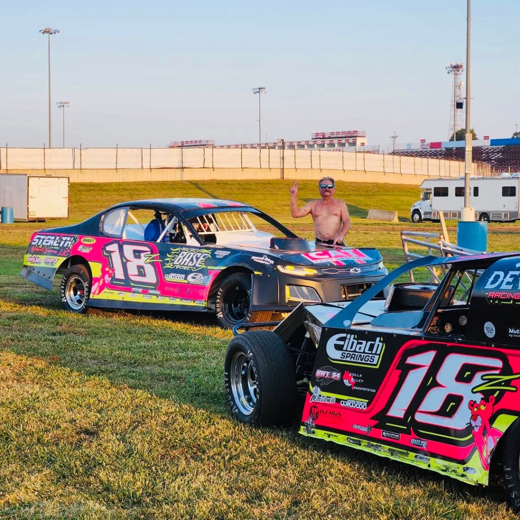 Two DeVilbiss cars at the track