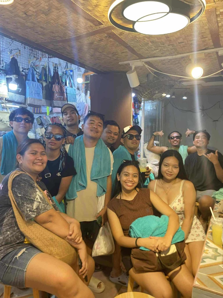 Barista with a group of customers at the Sisay Coffee shop in Boracay