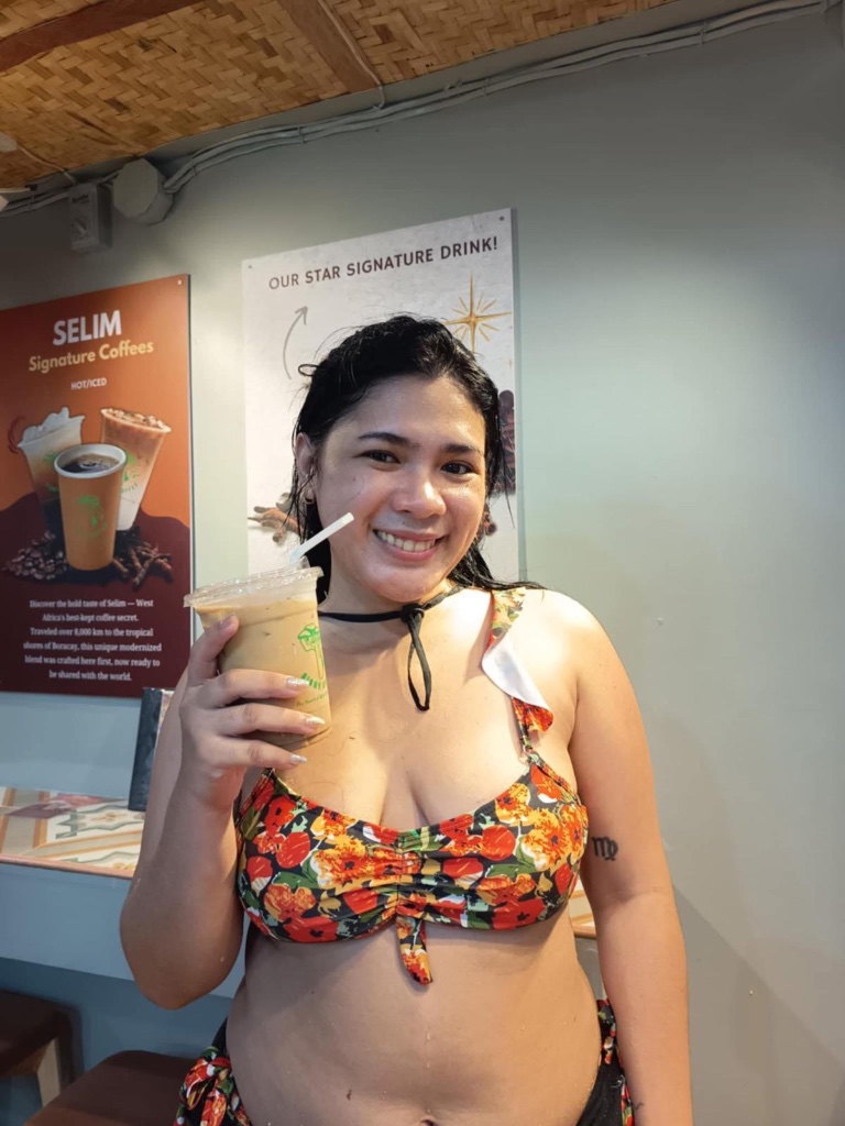 Customer enjoying an iced Sisay Coffee at the Boracay shop