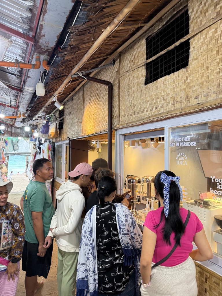 Customers discovering Selim coffee for the first time at the Sisay beachfront shop in Boracay