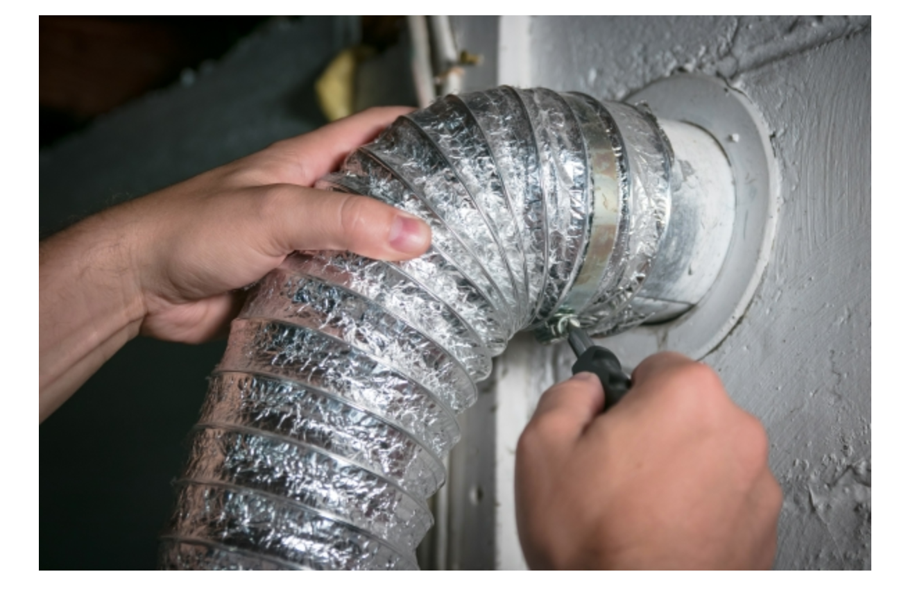 Comparison of a lint-clogged dryer vent next to a freshly cleaned vent duct