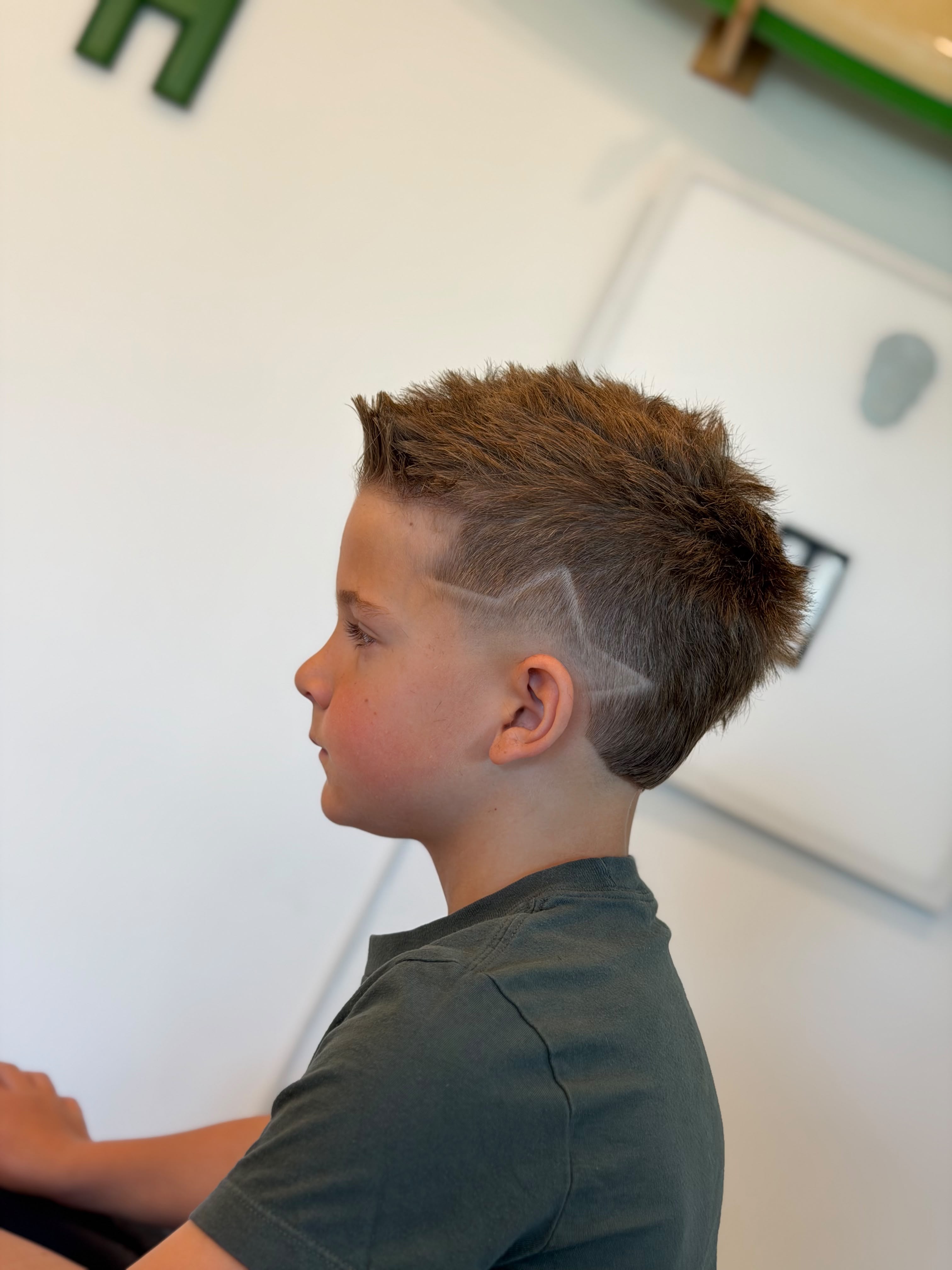Star Design Fade hairstyle result - Textured Top / Star Razor Design