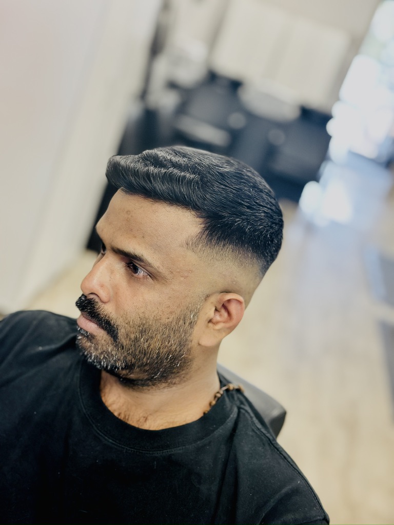 Profile Fade hairstyle result - Skin Fade / Groomed Beard