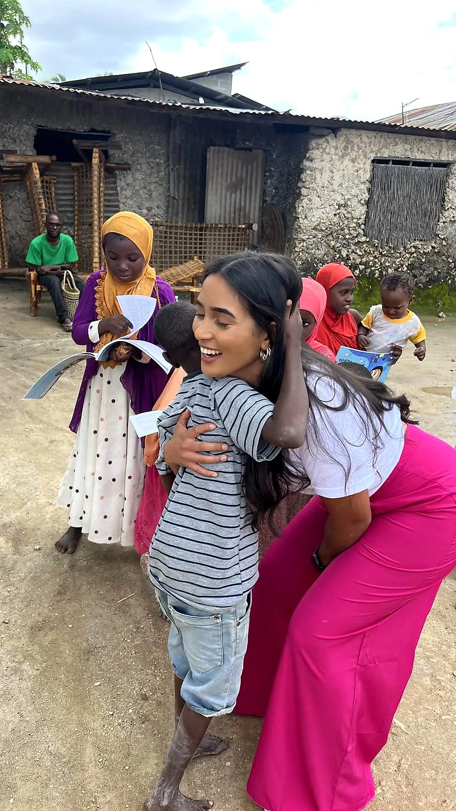 Cindy with children in the community