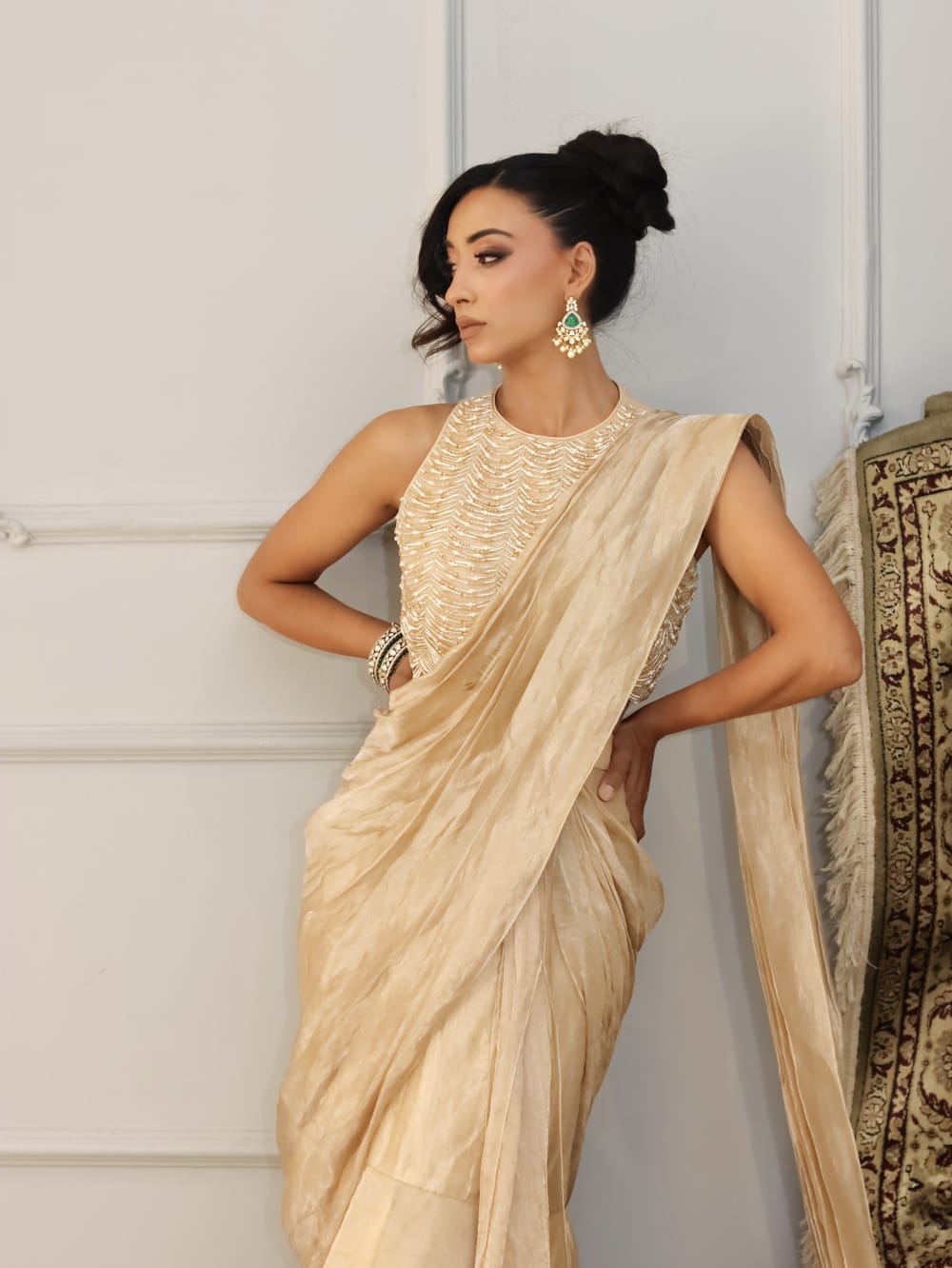 Champagne gold pre-draped saree with pearl halter blouse