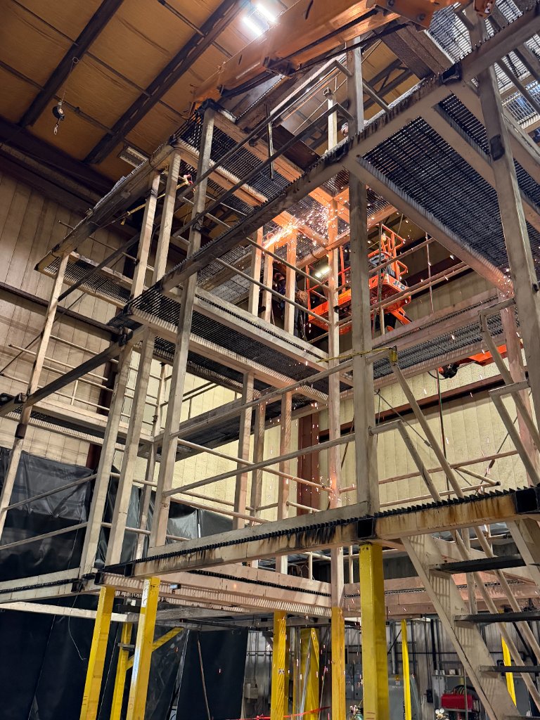 Interior structural steel construction with welding sparks