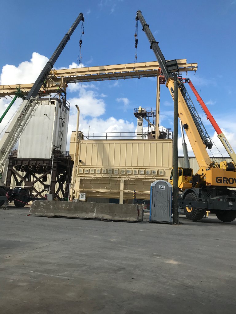 Industrial capitol project site with cranes and steel structures