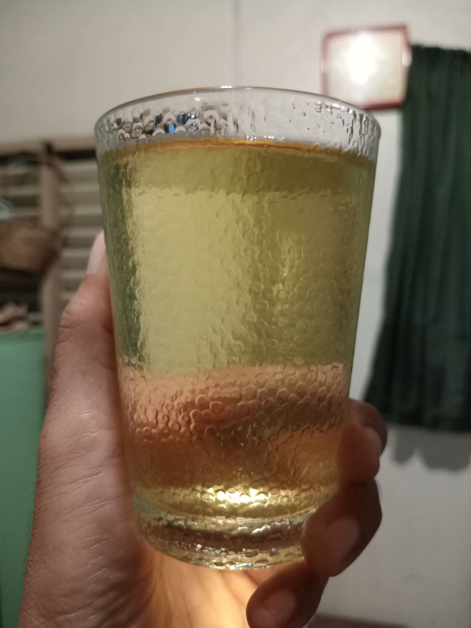 Hand holding a glass