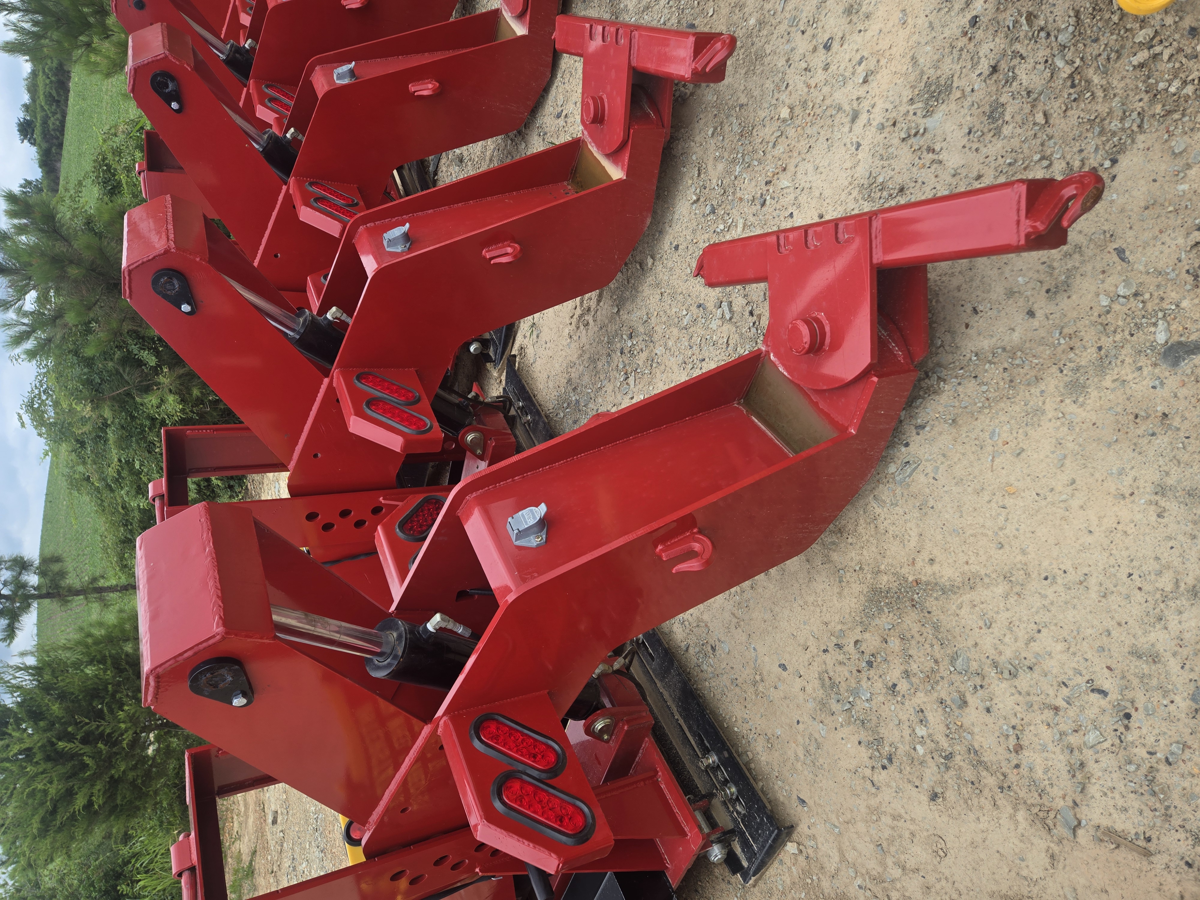 Close-up of hydraulic cylinder with chrome piston