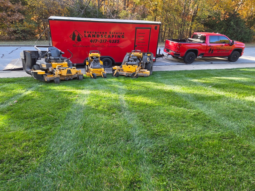 Wright mower on leaf-covered autumn lawn