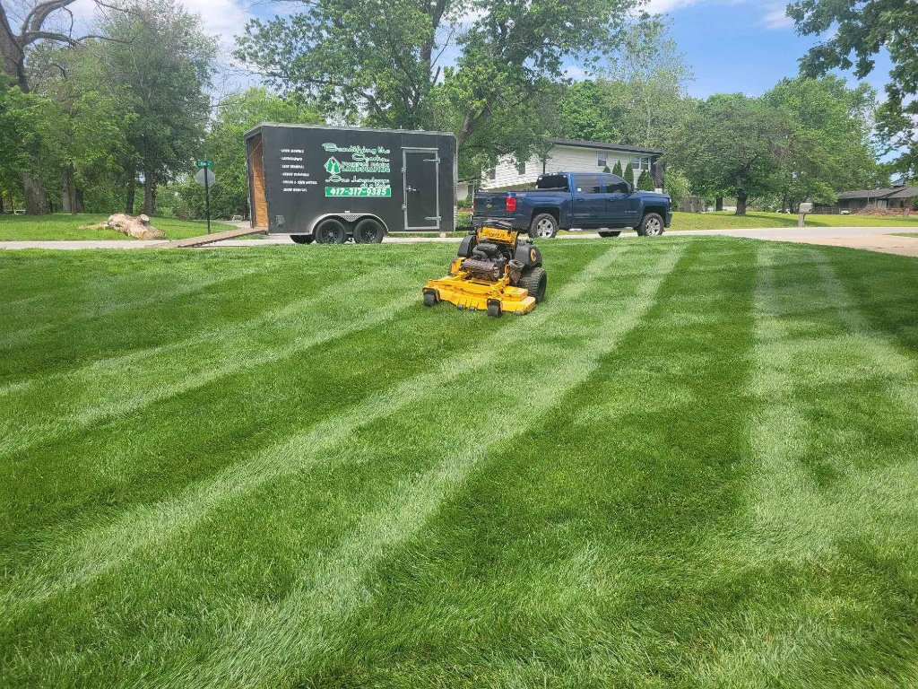 Commercial mowing with Evergreen Estates truck and trailer