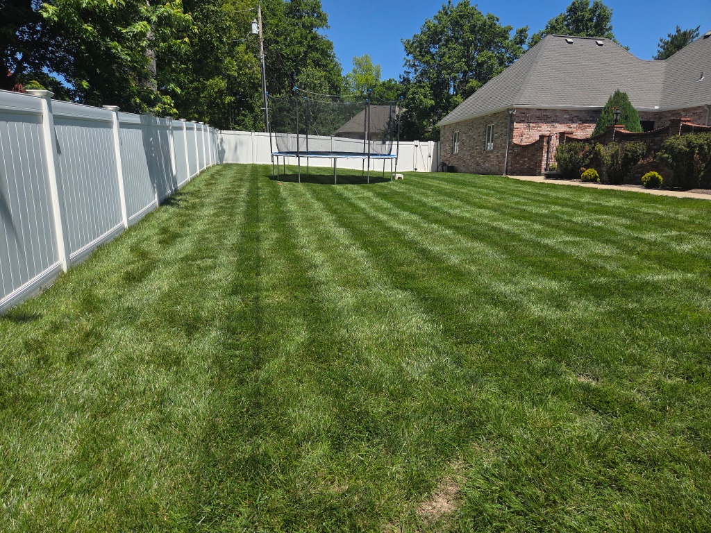Striped lawn in front of residential home