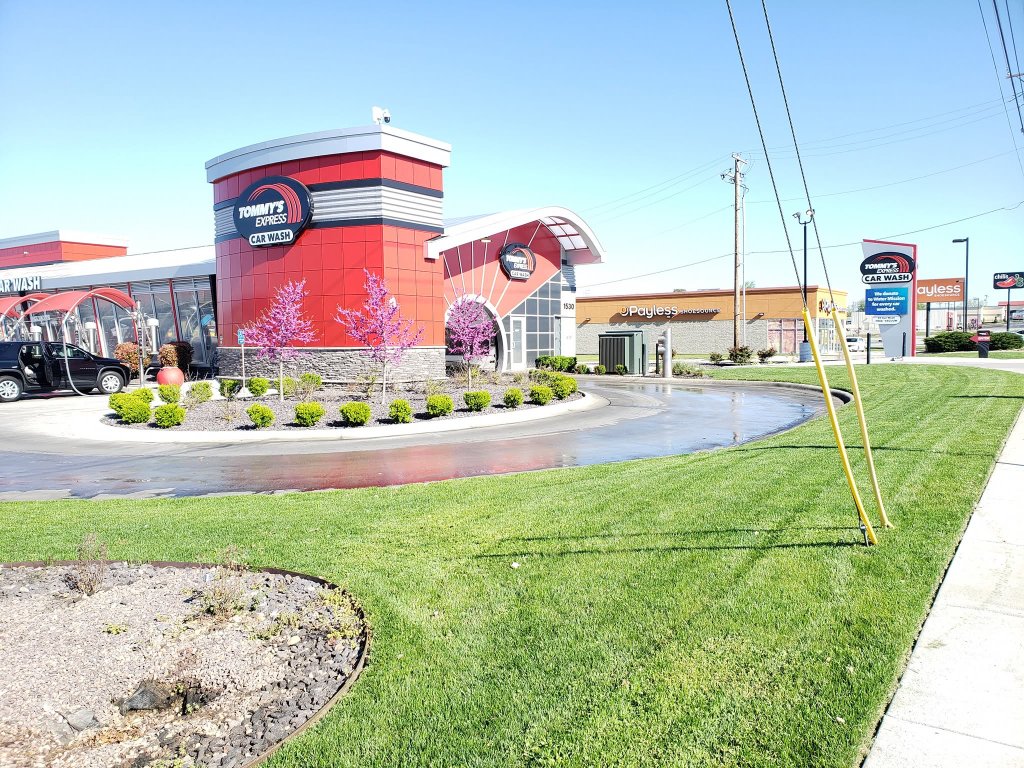 Car wash commercial landscaping with flower beds and lawn
