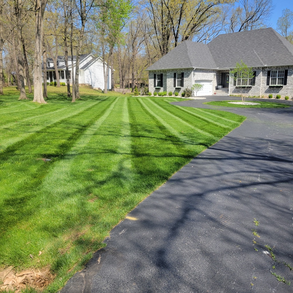 Perfectly striped estate lawn from street view