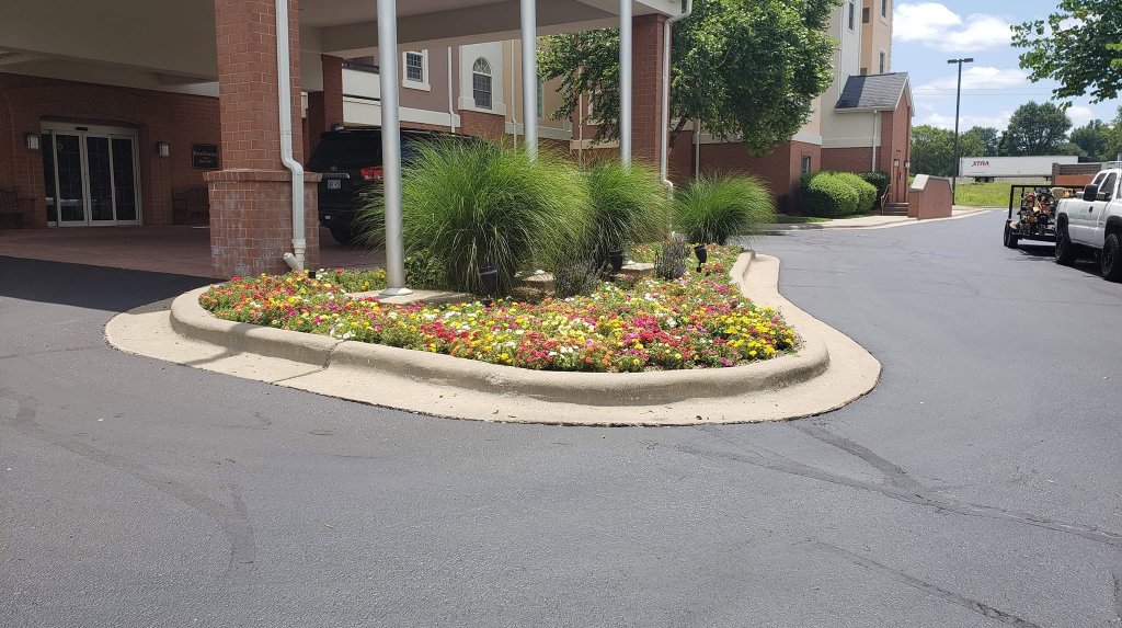 Hotel entrance colorful flower bed landscaping