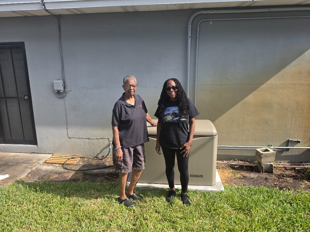 Two happy customers with Kohler generator - Never Dark standby generator installation in Greer, SC