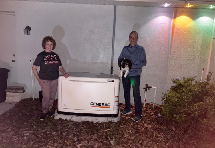 Couple with Generac standby generator - Never Dark standby generator installation in Valrico, FL
